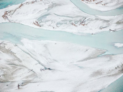 This is an aerial photograph of a braided river system from glaciers